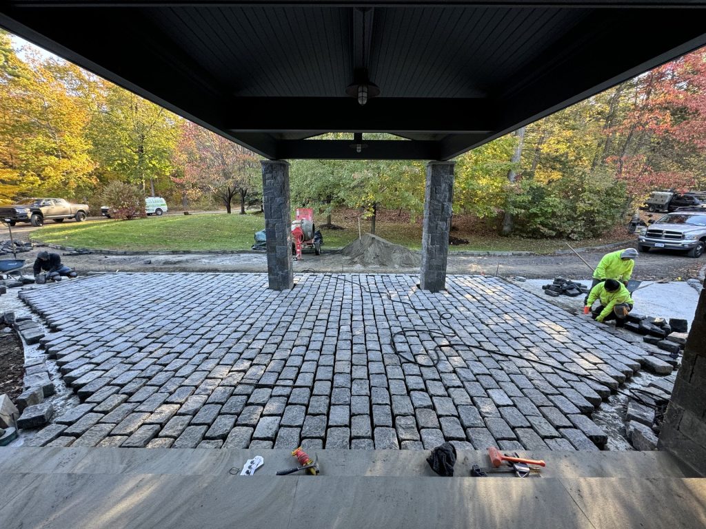 Paver patio installation in progress at a Dutchess County home