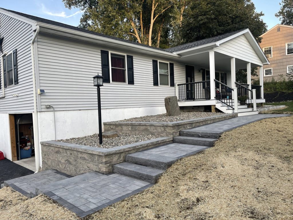 Ranch home paver walkway installation by Dutchess Lawns & Masonry