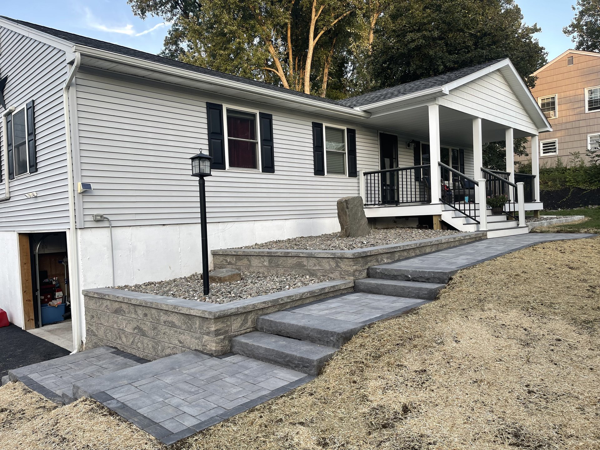 Ranch home paver walkway installation by Dutchess Lawns & Masonry