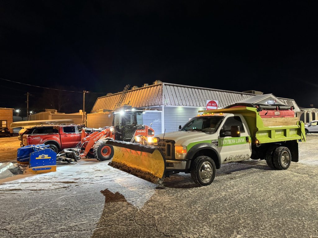 Dutchess Lawns & Masonry snow plow fleet on a night operation